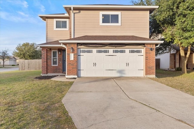 front of property featuring a front yard and a garage