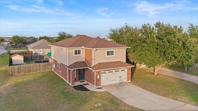 view of front of property with a front lawn and a garage