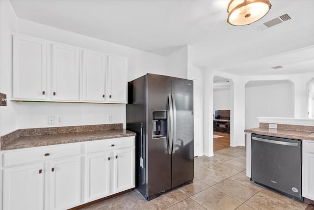 kitchen featuring dishwasher, black fridge with ice dispenser, white cabinets, and light tile patterned flooring