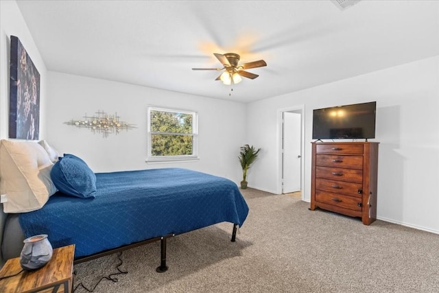 bedroom with light colored carpet and ceiling fan