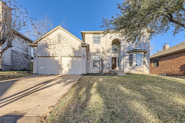 view of front facade featuring a front yard and a garage