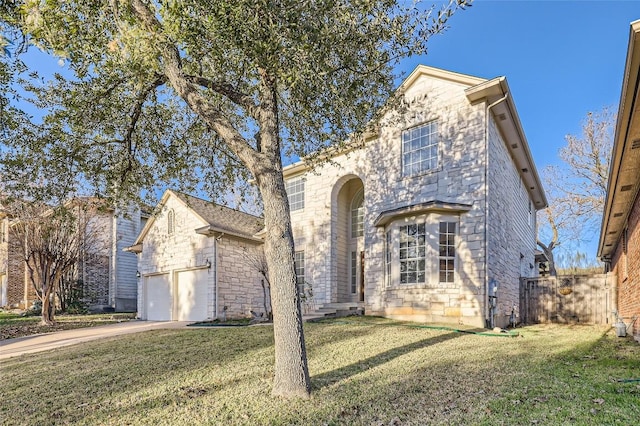 view of front of house featuring a front yard and a garage