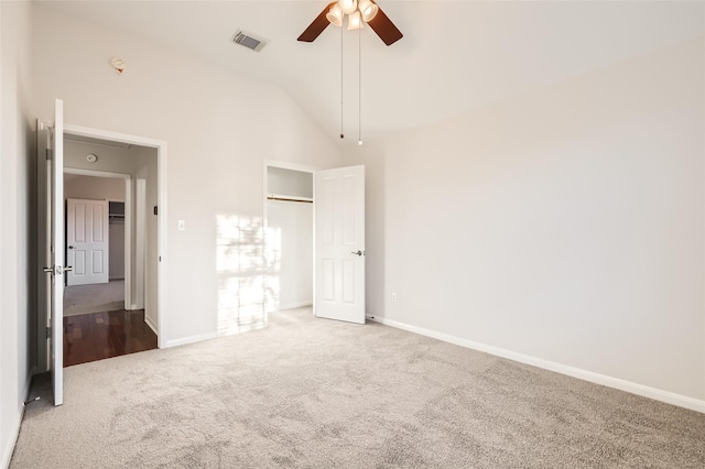 unfurnished bedroom featuring ceiling fan, carpet floors, and high vaulted ceiling