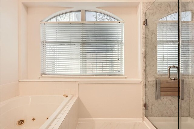 bathroom with a wealth of natural light and plus walk in shower