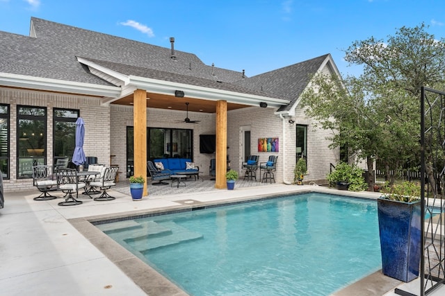 305 Spicewood Trails Dr, Spicewood, TX 78669 - outdoor pool featuring ceiling fan, a patio area, and an outdoor living space
