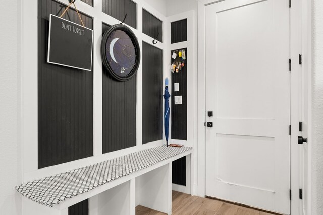 mudroom with light wood-style flooring