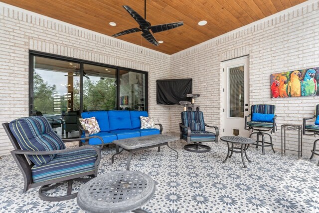 view of patio with an outdoor living space and a ceiling fan