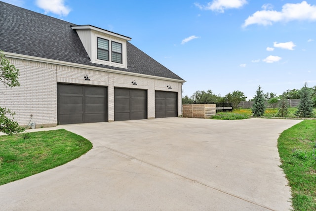 garage featuring driveway