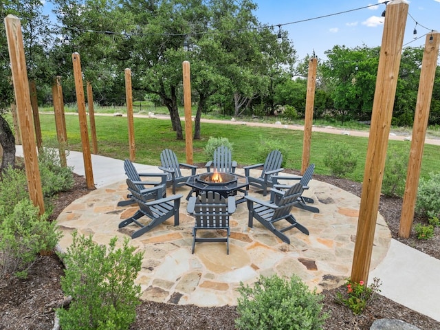 305 Spicewood Trails Dr, Spicewood, TX 78669 - view of patio featuring a fire pit and view of scattered trees