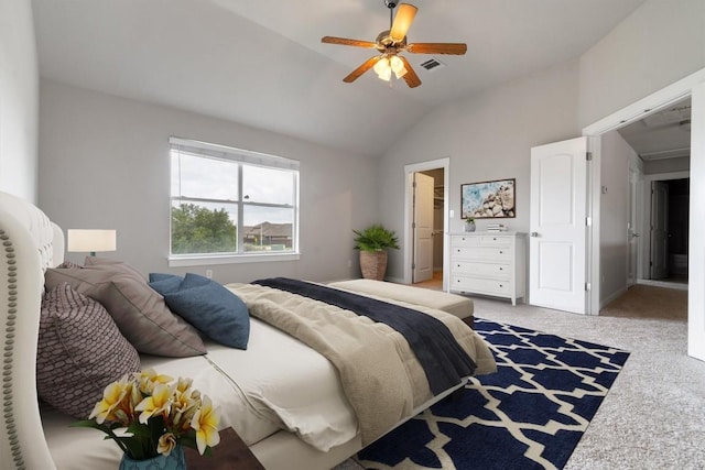 carpeted bedroom with ceiling fan and lofted ceiling