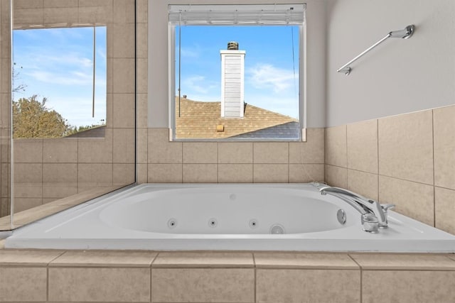 bathroom featuring tiled tub