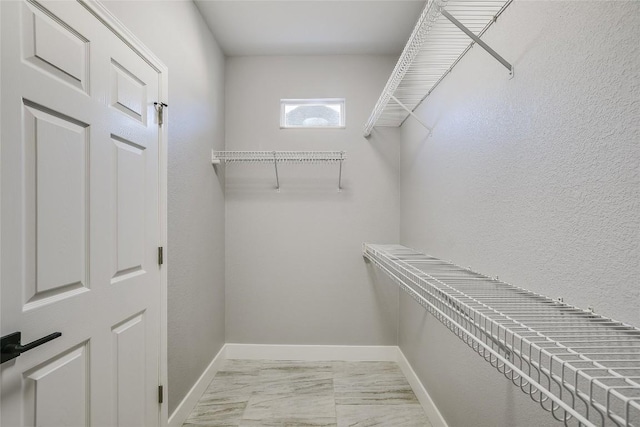 219 Red Poppy Trl, Georgetown, TX 78633 - spacious closet with light marble finish floors