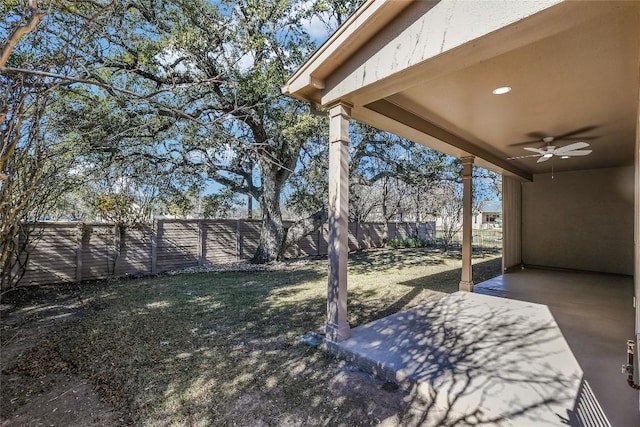 219 Red Poppy Trl, Georgetown, TX 78633 - fenced backyard with a ceiling fan and a patio