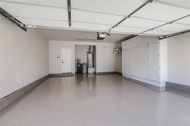 219 Red Poppy Trl, Georgetown, TX 78633 - garage with baseboards and a garage door opener