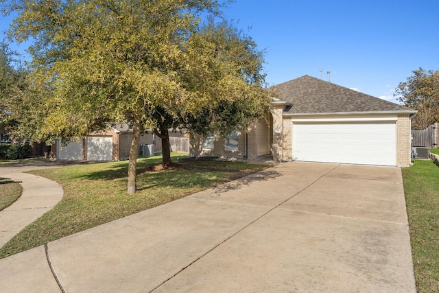 view of front of property with a garage and a front yard