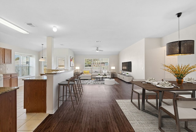 dining room featuring light wood-type flooring and ceiling fan