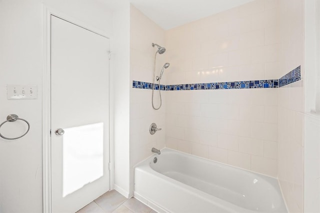 bathroom with tile patterned flooring and tiled shower / bath