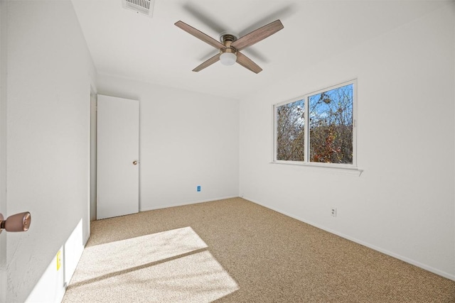 unfurnished room with light colored carpet and ceiling fan