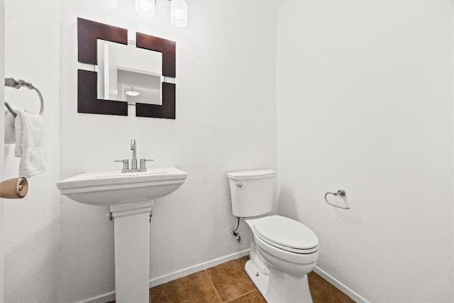 bathroom featuring tile patterned floors and toilet