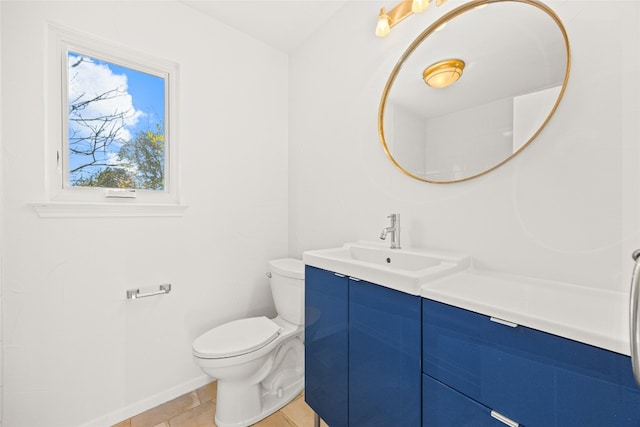 bathroom with tile patterned floors, vanity, and toilet