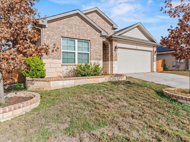 view of front of house with a garage and a front yard