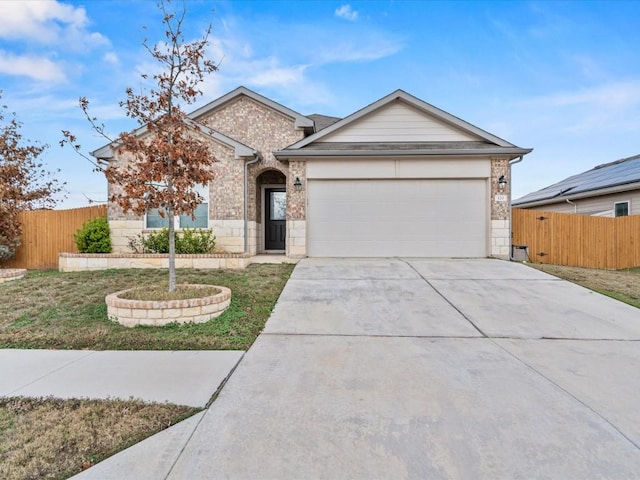 ranch-style house with a garage and a front yard