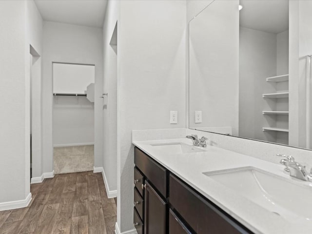 bathroom featuring vanity and hardwood / wood-style flooring