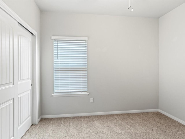 spare room with light carpet