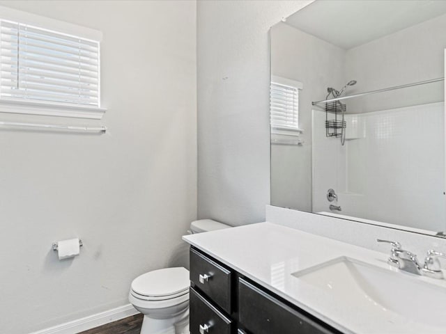 full bathroom with shower / bathing tub combination, vanity, toilet, and wood-type flooring