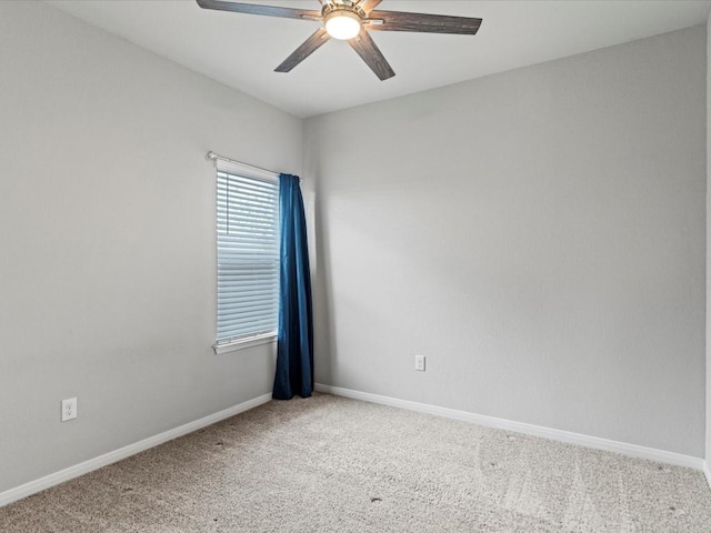 spare room featuring carpet flooring and ceiling fan