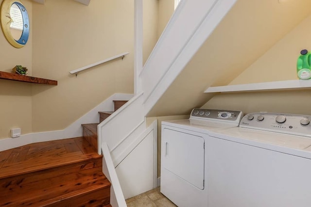 clothes washing area featuring washing machine and clothes dryer