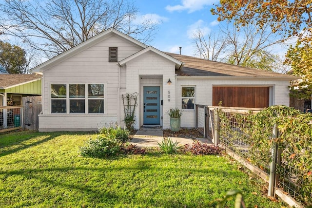 single story home featuring a front yard