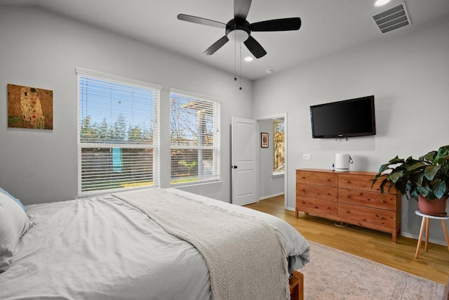 bedroom with hardwood / wood-style flooring and ceiling fan