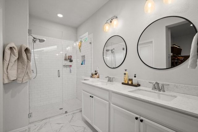 bathroom featuring vanity and an enclosed shower