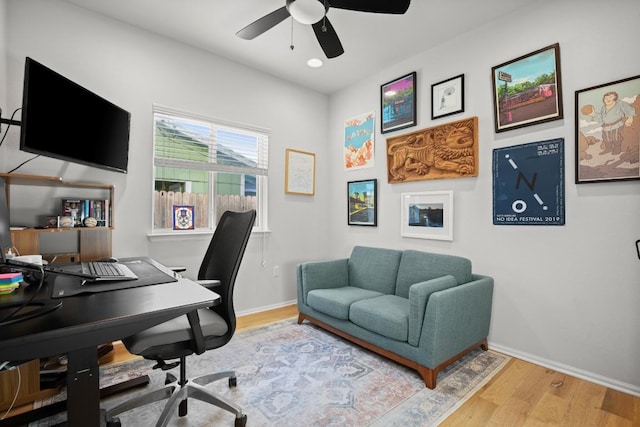 office featuring hardwood / wood-style flooring and ceiling fan