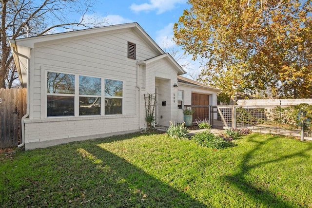 rear view of property featuring a yard