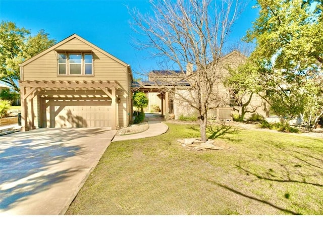 view of front of home with a garage and a front lawn