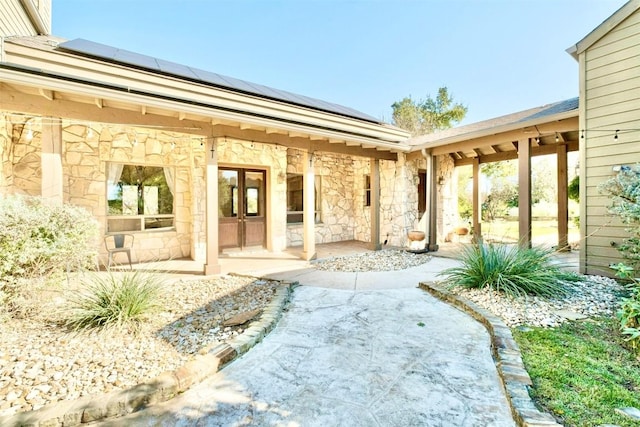 property entrance with french doors and solar panels