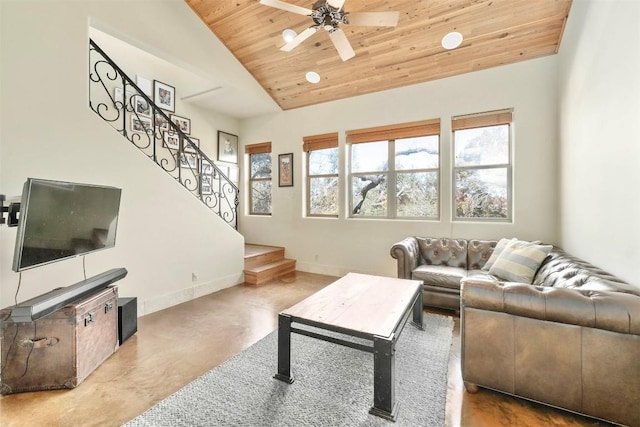 living room with ceiling fan, lofted ceiling, wood ceiling, and concrete floors