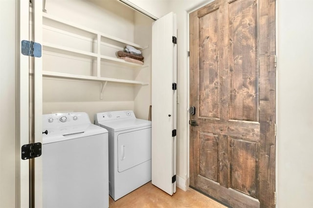 washroom featuring washer and clothes dryer