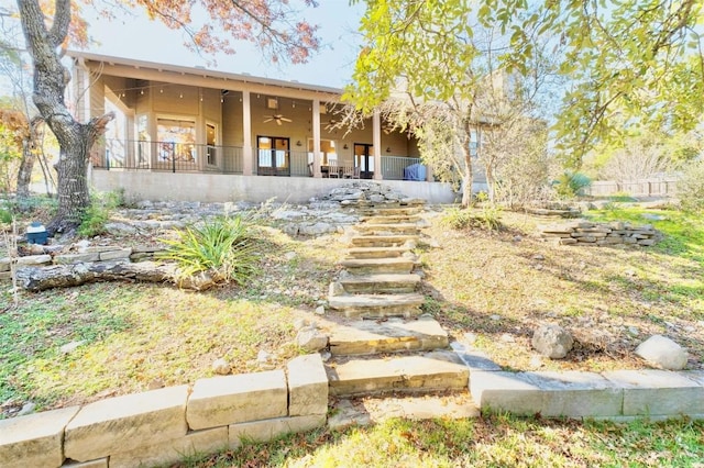 back of property featuring ceiling fan