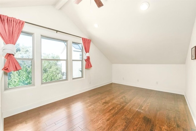 bonus room with ceiling fan, lofted ceiling with beams, and dark hardwood / wood-style floors