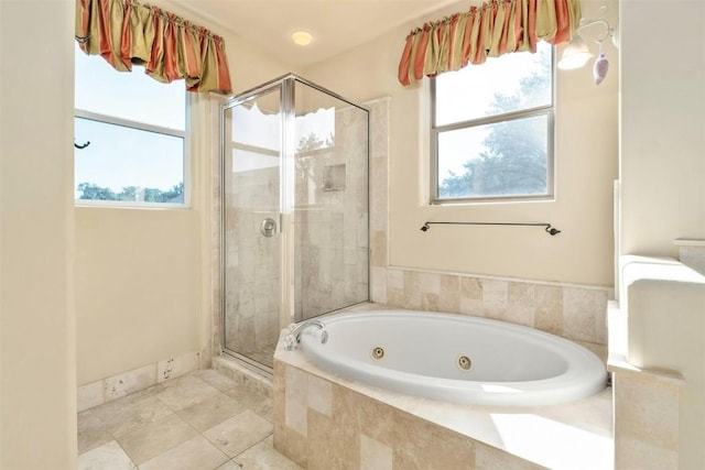 bathroom with shower with separate bathtub