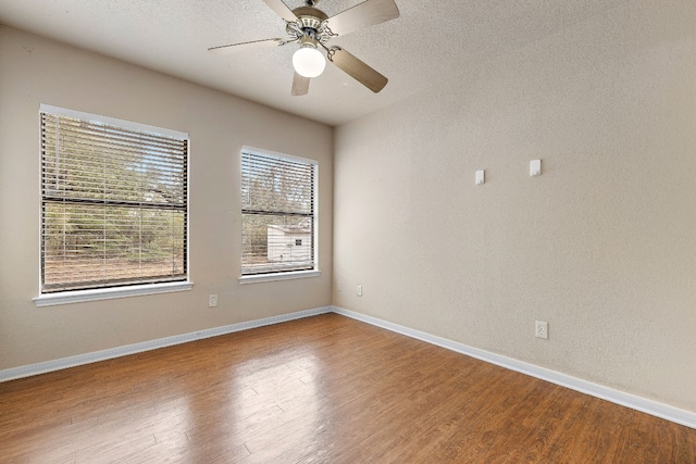 unfurnished room with hardwood / wood-style flooring and ceiling fan