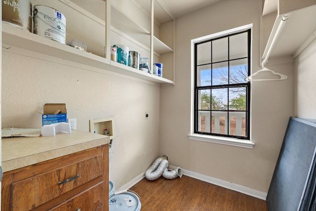 washroom featuring electric dryer hookup, dark wood-type flooring, and hookup for a washing machine