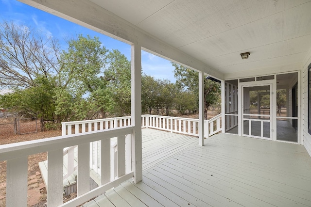 wooden deck featuring a sunroom