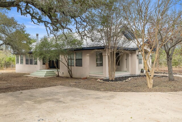 rear view of house with a patio