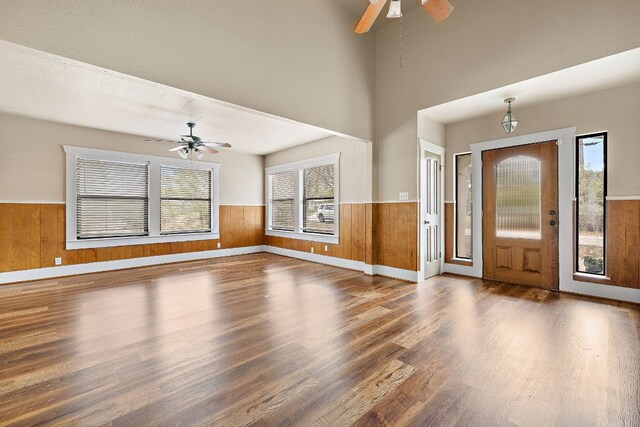 foyer entrance featuring ceiling fan and dark wood-type flooring