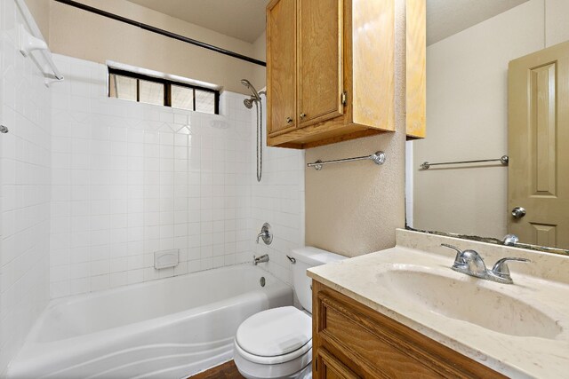 full bathroom featuring shower / tub combination, vanity, and toilet