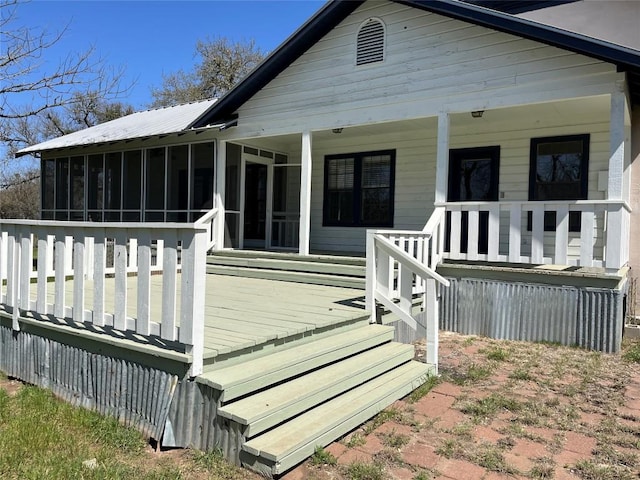 3480 Jack C Hays Trl, Buda, TX 78610 - back of house featuring metal roof and a sunroom